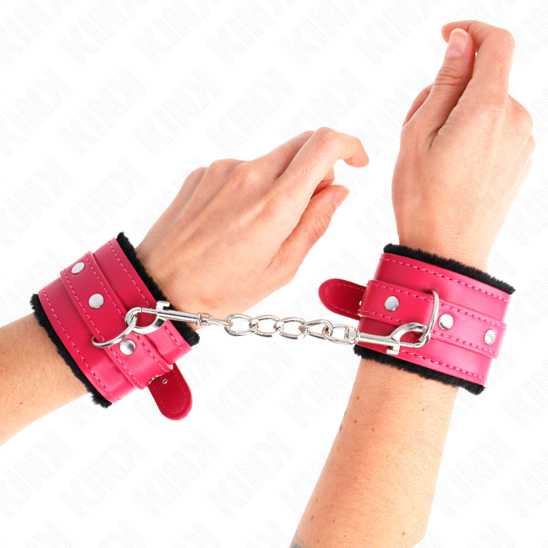 KINK - SUJETADORES DE MUÑECAS CON FORRO DE PIEL PREMIUM NEGRO CON CINTURÓN ROSA FRAMBUESA AJUSTABLE 17-29 CM X 6 CM